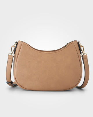 Tan handbag with gold accents on a light gray background