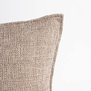 Close-up of a textured brown fabric on a light gray background