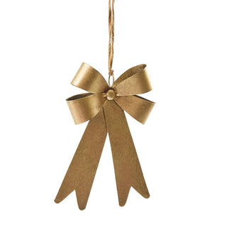 Gold bow ornament on a white background