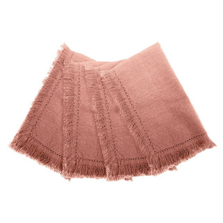 Pink napkins with frayed edges on a white background