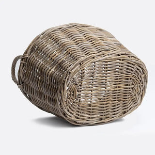 Woven rattan basket on a light gray background